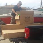 Executive-Director-Peter-Abajian-getting-the-playground-parts-ready-for-shipment.