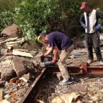 Workers carefully dismantle the domik and recycle most of its parts.